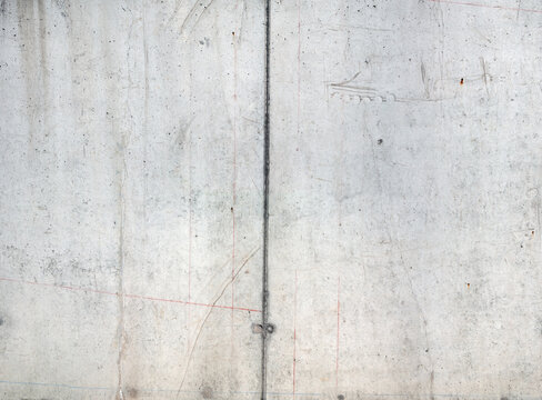 A raw, untreated exposed concrete surface with a slightly irregular texture.