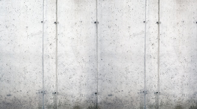 A raw, untreated exposed concrete surface with a slightly irregular texture.
