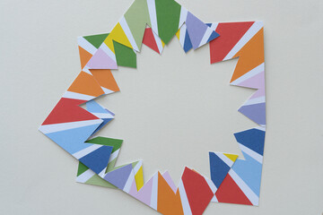 Obraz premium zig-zag frame machine-cut from bold crafting paper with rainbow starbursts
