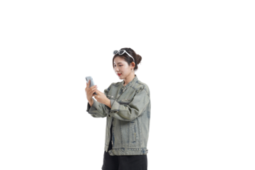 Modern Connectivity: A vibrant young woman engaged with her smartphone in a clean, studio-style setting, conveying modern life.