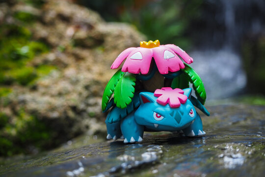 September 21 2025 - Figure Venusaur Pokemon - Toy Photography -enjoying amidst a lush forest with a beautiful waterfall behind