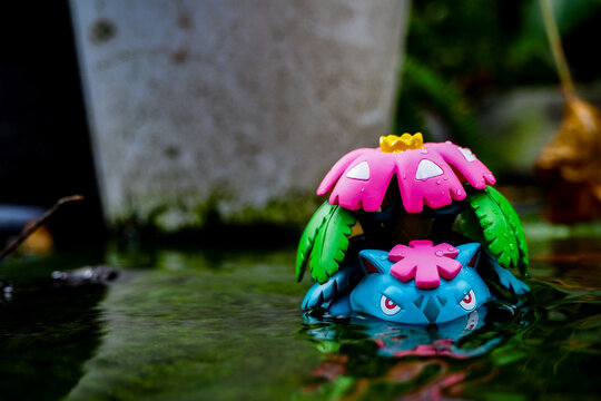 September 21 2025 - Figure Venusaur Pokemon - Toy Photography -enjoying amidst a lush forest with a beautiful waterfall behind