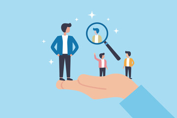 Hand holding diverse people under magnifying glass for recruitment and talent search
