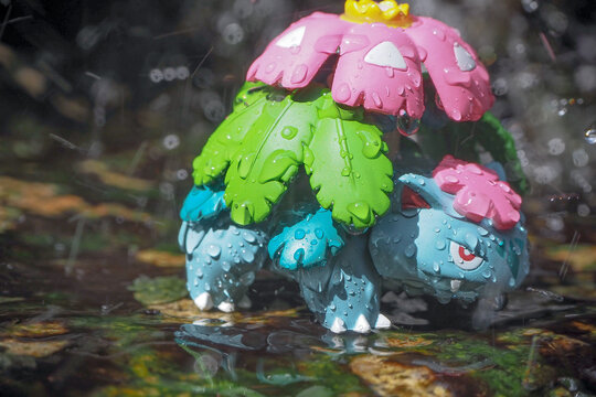 September 21 2025 - Figure Venusaur Pokemon - Toy Photography -enjoying amidst a lush forest with a beautiful waterfall behind