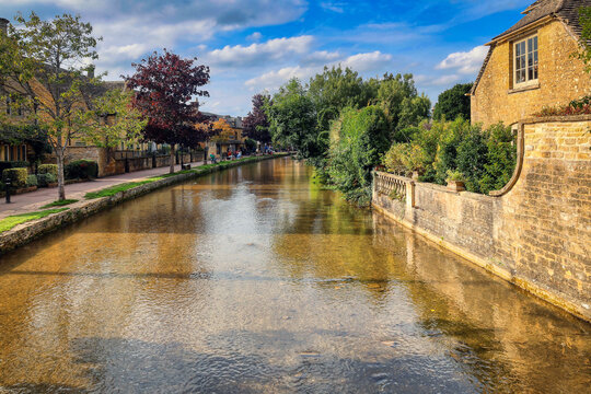 The historic town of Bourton on the water, in the Cotswolds, is famous for its historic stone buildings and canals. The town is in Gloucestershire county, UK