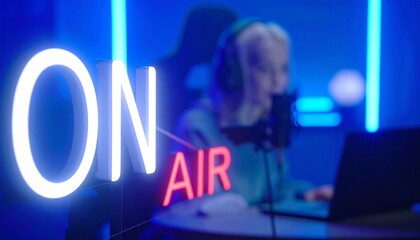 Vibrant 'ON AIR' neon sign brightly illuminates a contemporary digital studio, setting the scene for a content creator actively engaged in live streaming or podcasting