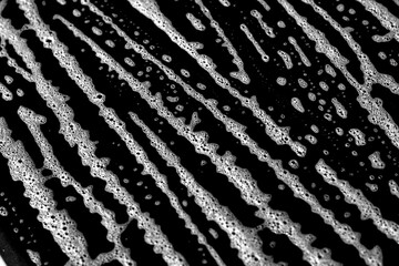 Decorative abstract black and white surface. Distressed grunge texture background with unique scratches and surface details for artistic projects.