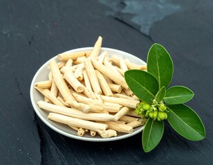 Dried plant stems on a plate, with leaves