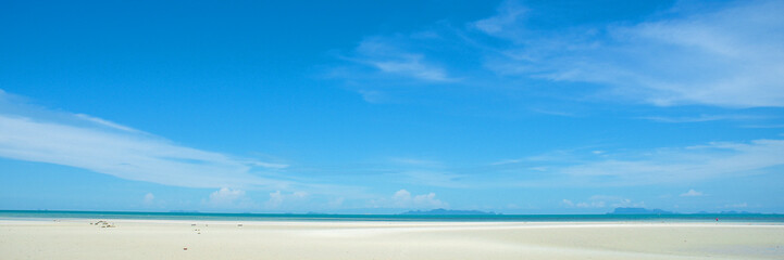 Skyline of Serenity: A breathtaking shot where a pristine beach meets the vast expanse of an azure sky, creating an image of ultimate serenity. Evoking a sense of freedom and peace.
