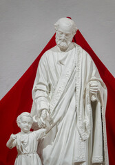 Statue (19th century) of Saint Joseph with baby Jesus Christ.