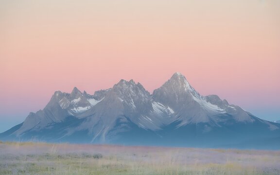Jagged Mountain Peaks at Sunset with Pastel Sky Keywords: mountain, mountains, peak, peaks