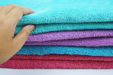 hand torching stack of terry towel