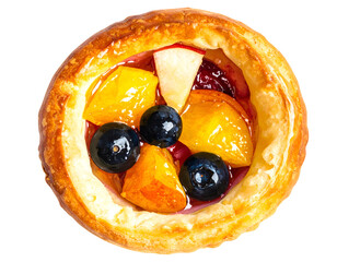 Fruit tart top view with glossy blueberries and peach pieces on custard in a golden pastry shell on isolated background