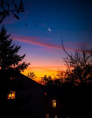 Dusk over a house with trees