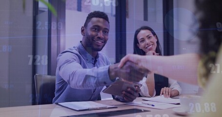 Shaking hands man wearing blue shirt holding tablet at office meeting with clipboard, data overlays