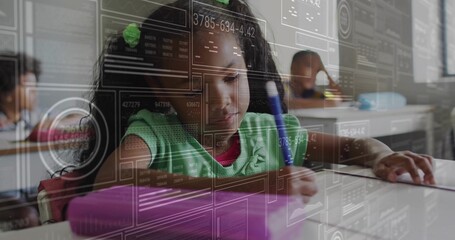 Writing girl wearing green sweater in primary school classroom, with blue pen, digital overlay