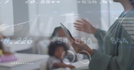 Gesturing female instructor holding digital tablet in classroom, with data overlays, copy space