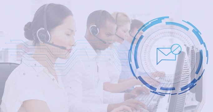 Typing at computer keyboards call center agents in office, with headsets and digital envelope icon