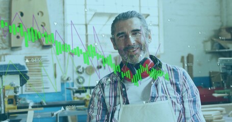 Standing bearded woodworker wearing apron and hearing protectors in workshop, with graph overlays