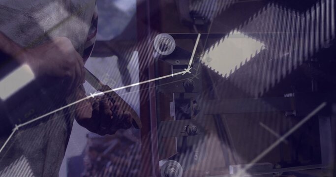 Shaping blank on lathe in workshop by craft worker holding chisel with graph overlays, copy space