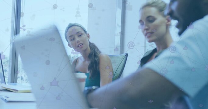 Collaborating professionals sharing ideas in meeting room, with laptop notebook pens network icons