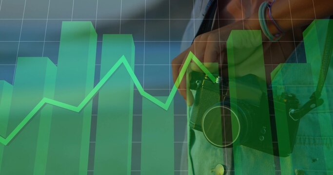 Photographer wearing denim jacket holding vintage camera against data chart grid, copy space - Powered by Adobe