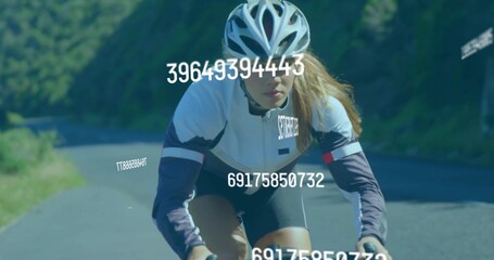 Pedaling lone female cyclist wearing jersey, helmet and gloves up mountain road, with data overlays