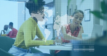 Collaborating coworkers pointing at documents on round table in office lounge, world-map overlay