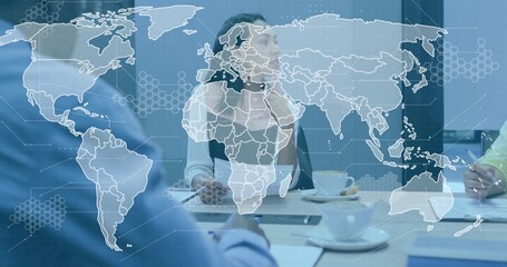 Collaborating team in suits analyzing data in meeting room, with tablet cups world map overlay