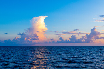 Sunset with sea. Colorful majestic scenery sunset sky with amazing clouds and waves. Beautiful sunset over sea landscape