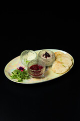 Gourmet Appetizer Platter with Spreads and Greens