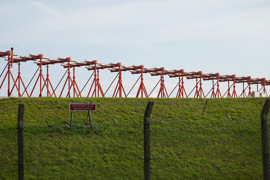 Instrument Landing System ILS Critical Area sign and antenna array at East Midlands Airport Trail Nottinghamshire England travel photo