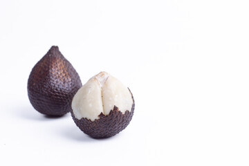 Pair of snake fruits, one whole and one peeled, on clean white background. Perfect for exotic fruit, tropical food, healthy eating, freshness, and copy space.
