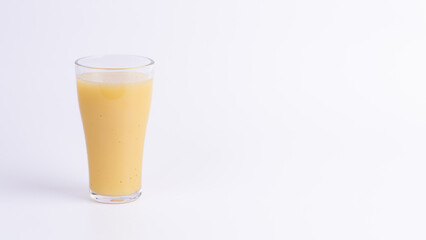 A refreshing glass of starfruit juice on white background, ideal for tropical beverage, healthy lifestyle, fresh nutrition, summer drink, and copy space.
