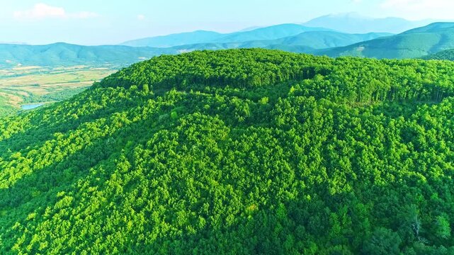 Aerial scenery, beautiful valley, mountains, green lush forest