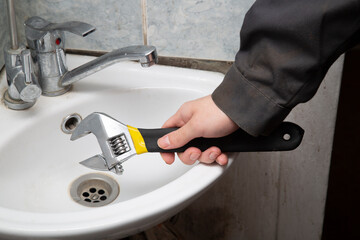 A plumber repairs water taps in your home.