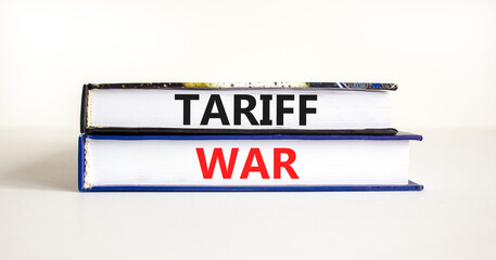 Trade tariff war symbol. Concept word Tariff war on beautiful books. Beautiful white paper background. Business trade tariff wars concept. Copy space.