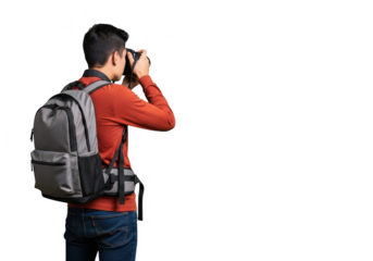 Man with backpack capturing memories with a camera amidst the darkness transparent background