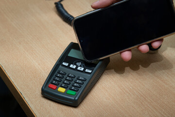 Contactless payment using a smartphone instead of a payment card.
