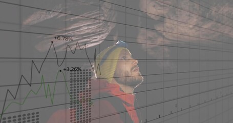Man with headlamp, knit cap, red jacket and backpack navigating in rocky cave, with digital graphs