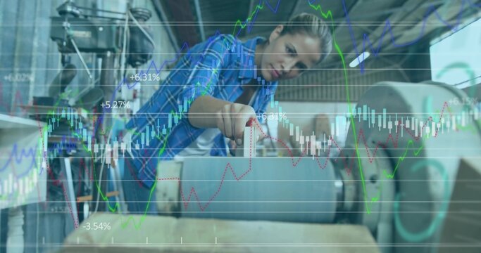 Machine operator in plaid shirt adjusting wooden plank under roller in factory, showing data graphs