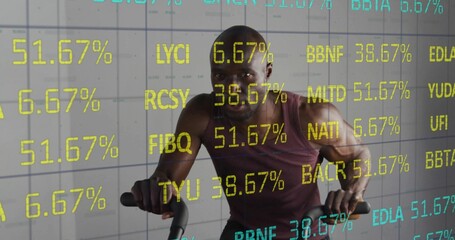 Pedaling male wearing red tank top powering workout in gym with bike handles, floating data overlay