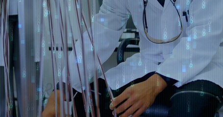 Doctor in white lab coat adjusting transparent tubing in clinic, with stethoscope