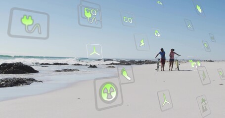 Naklejka premium Walking couple wearing casual clothes along beach with bicycle, longboard, energy icons, copy space