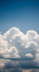 Puffy white cumulus clouds float across a vibrant blue sky on a clear day