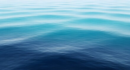 Deep blue and turquoise ocean waves gently rolling under a clear sky sea