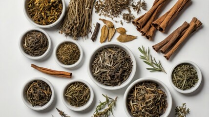 Fototapeta premium Assorted dried herbs and spices in small white bowls on a white background, showcasing a variety of textures and earthy tones.