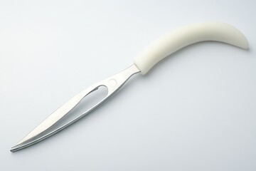 A sleek, modern utensil with a smooth white handle and a sharp stainless steel blade is displayed against a plain white background.