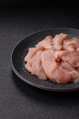 Strips of raw chicken or turkey fillet, skinless and boneless poultry breast. Chicken fillet strips