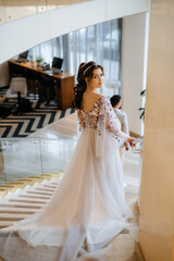 Fototapeta premium meeting of the bride and groom on the hotel stairs